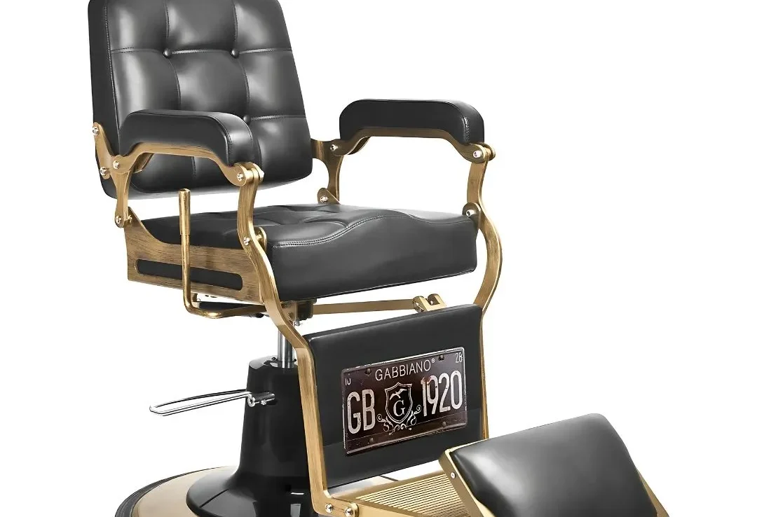 Chaise de coiffeur au design vintage, finition noire et or, idéale pour salons de coiffure haut de gamme