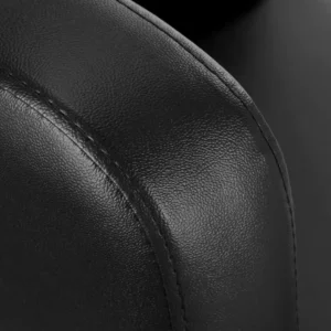 Gros plan sur le dossier ergonomique du fauteuil salon de coiffure, assurant un confort optimal pour chaque client.
