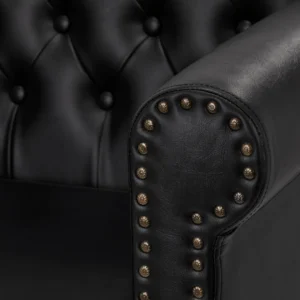 Zoom sur l’accoudoir du fauteuil coiffeuse noir, en simili cuir de qualité.